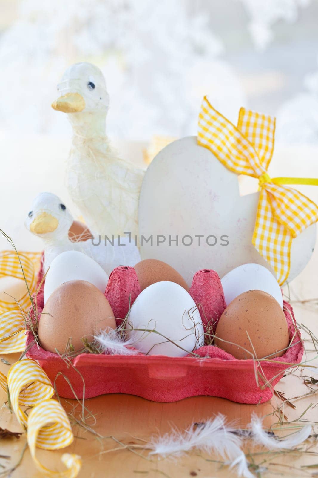 Red cardboard box with eggs and decorations for Easter