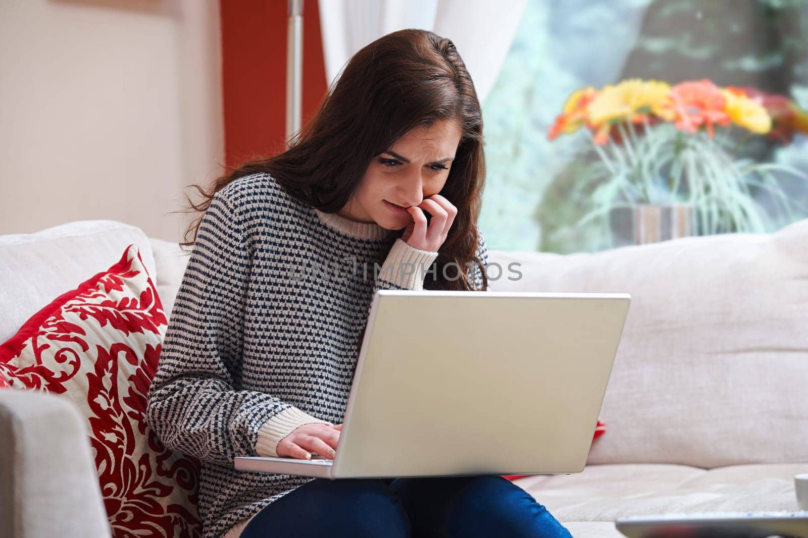 teenage girl looking worried due to internet bullying
