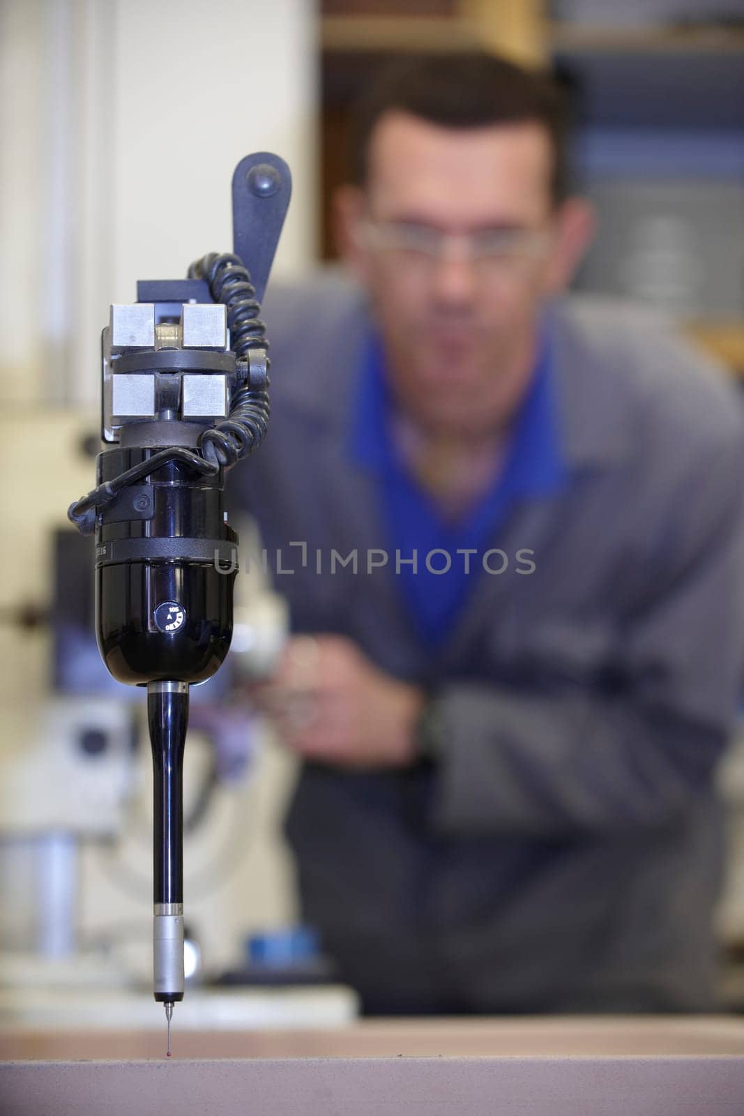 worker using a multisensor touch probe to inspect measurements