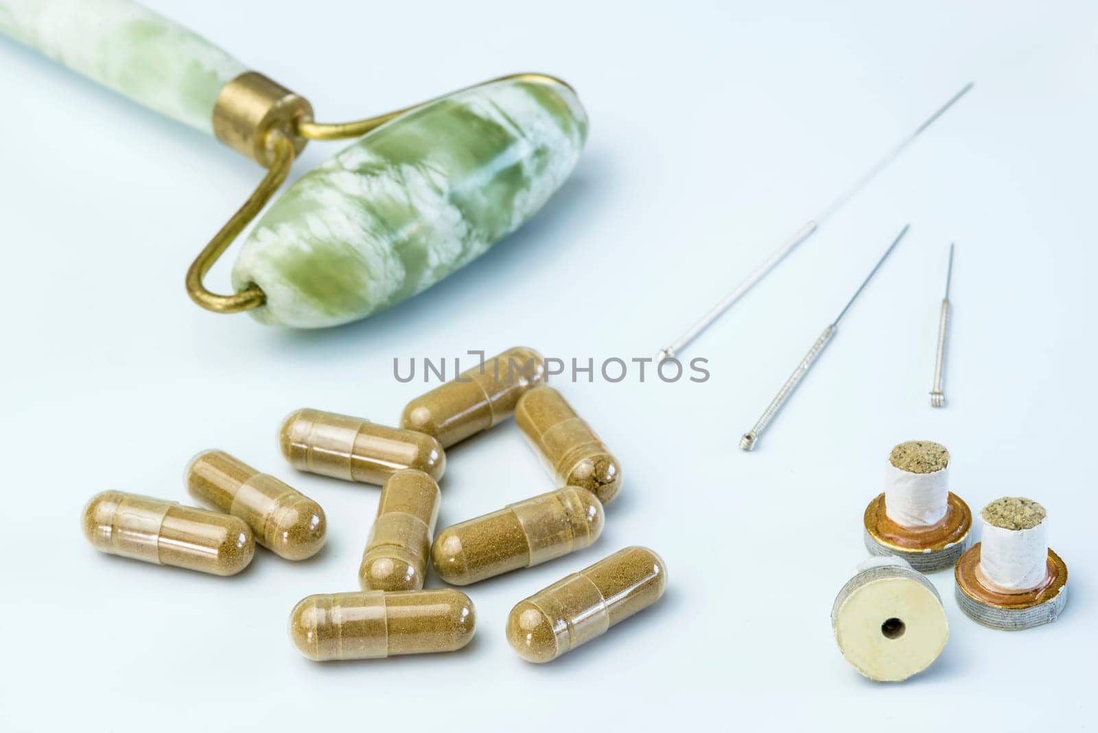 Acupuncture needles with moxa cones and herbal pills