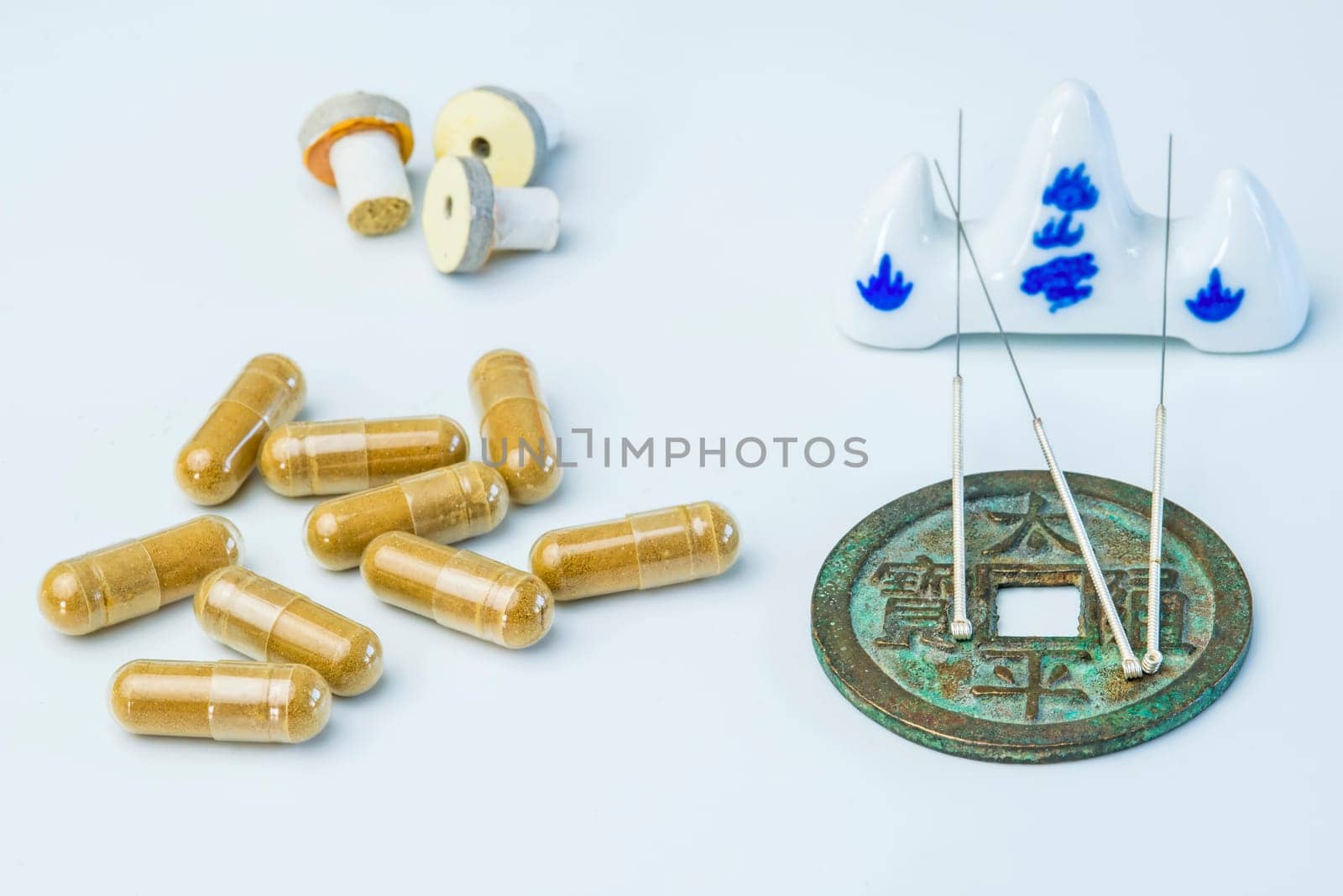 Acupuncture needles on antique Chinese coin