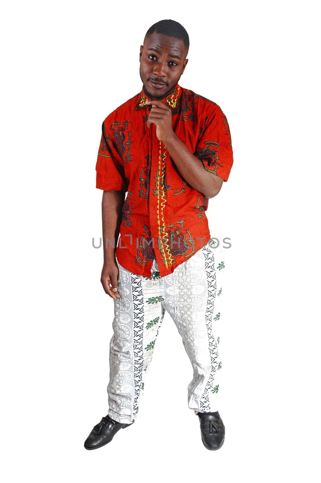 A black young man standing for white background, with his hands on.chin..