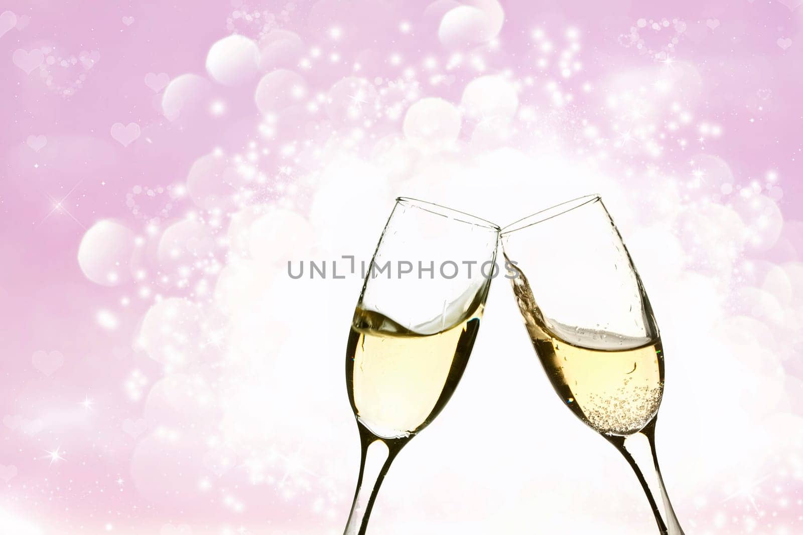 Glasses of champagne on background with blurred lights