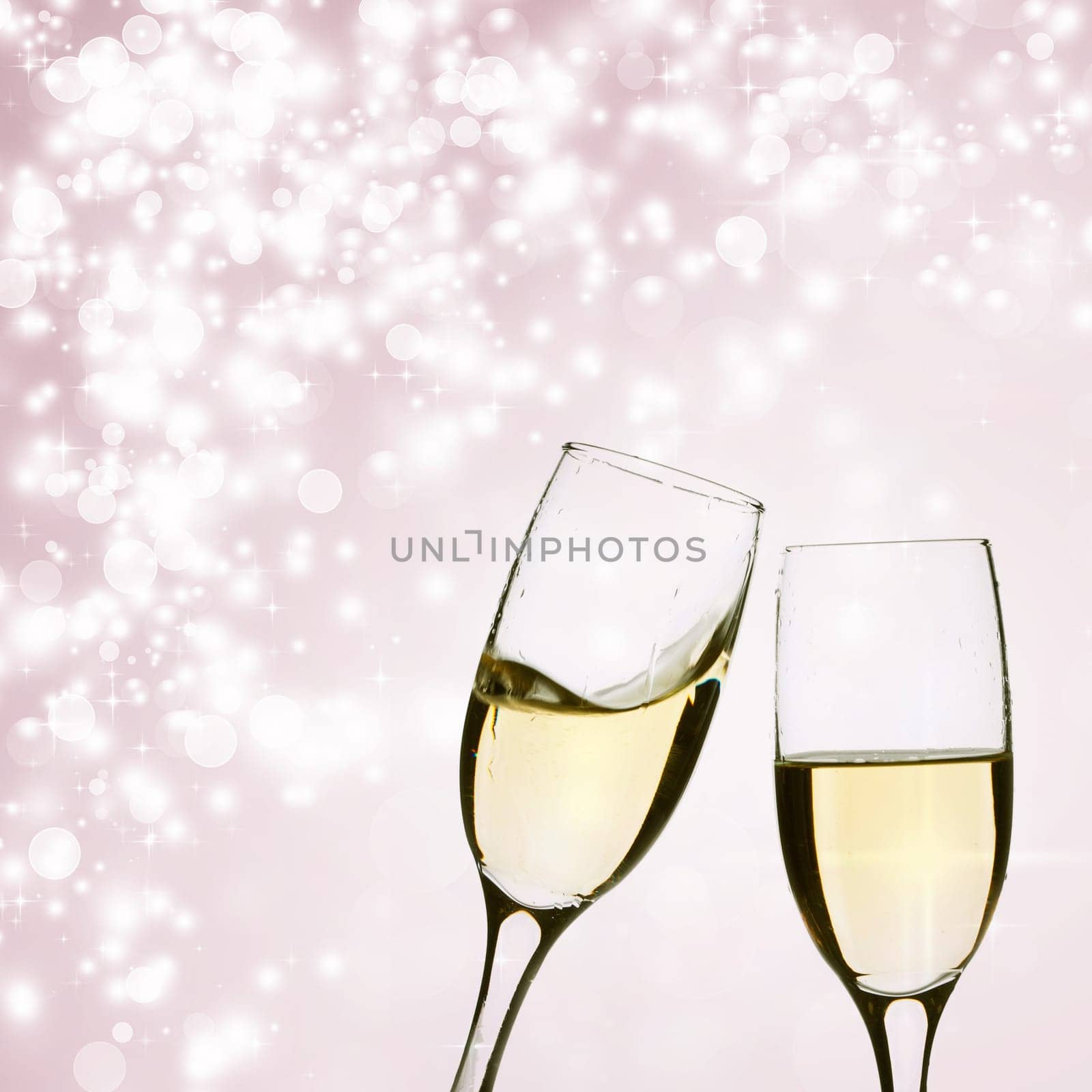 Glasses of champagne on background with blurred lights