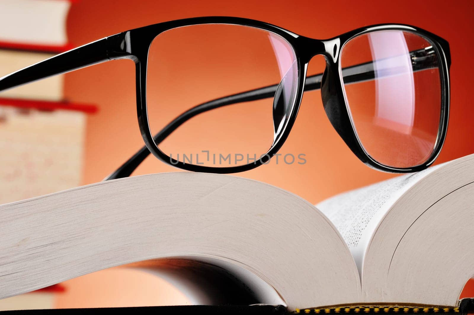 Composition with glasses and books on the table