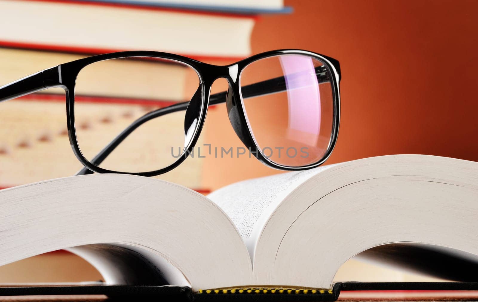 Composition with glasses and books on the table