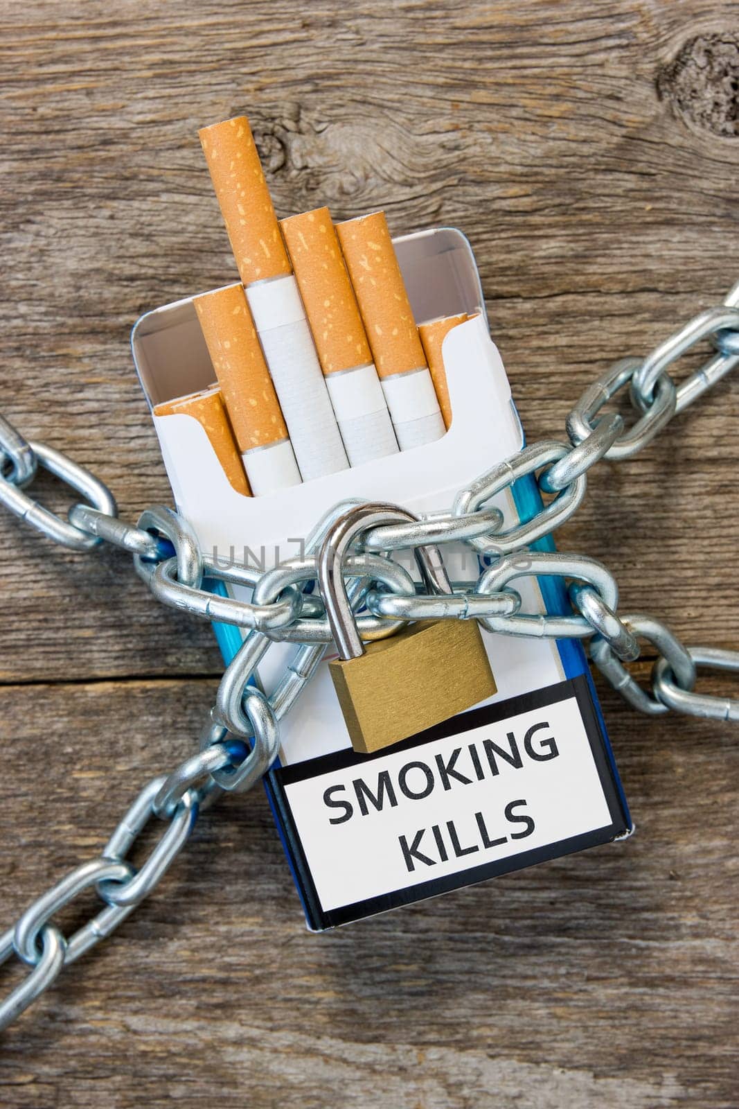 Pack of cigarettes and a padlock with chain