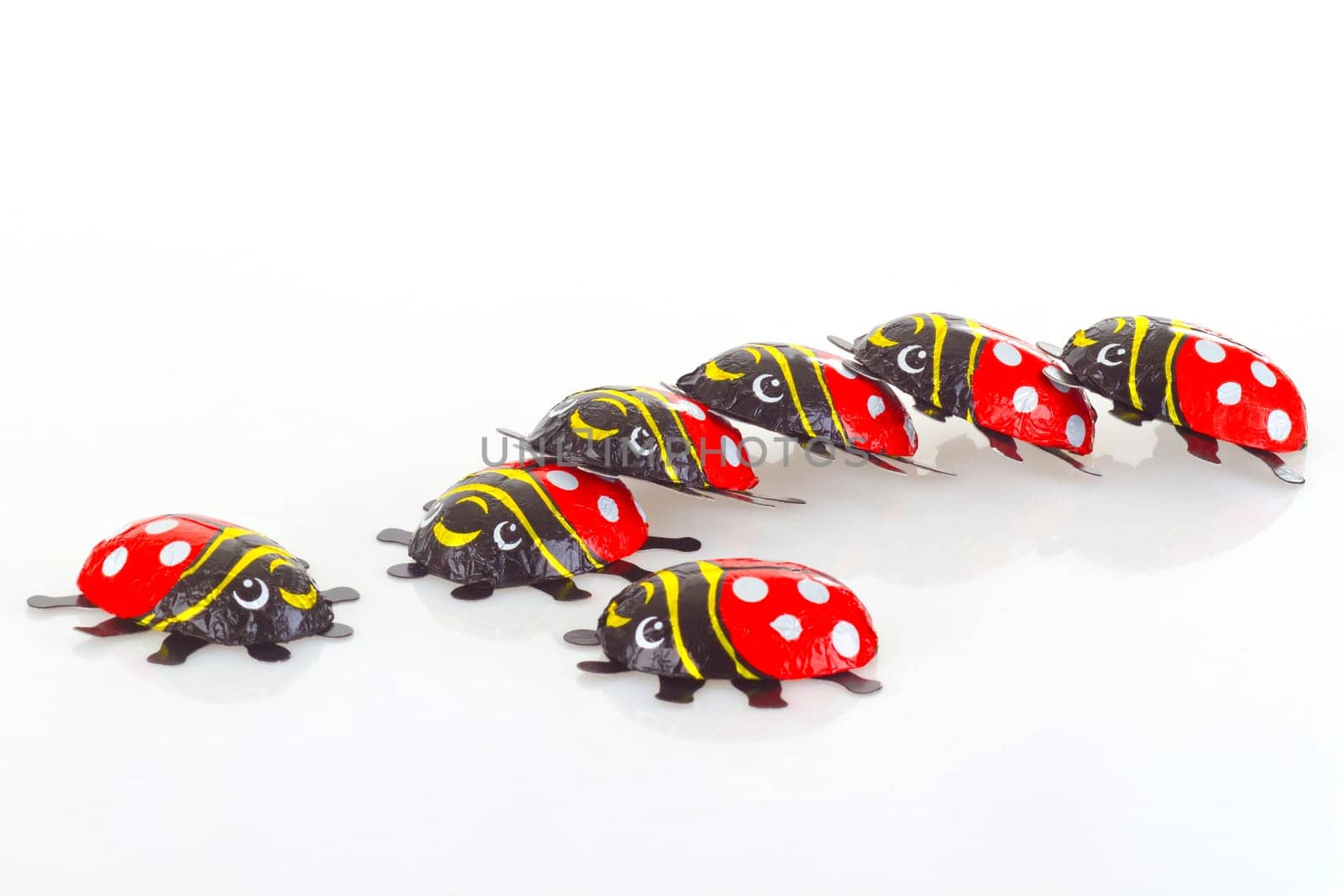 Ladybug made of chocolate on a light background