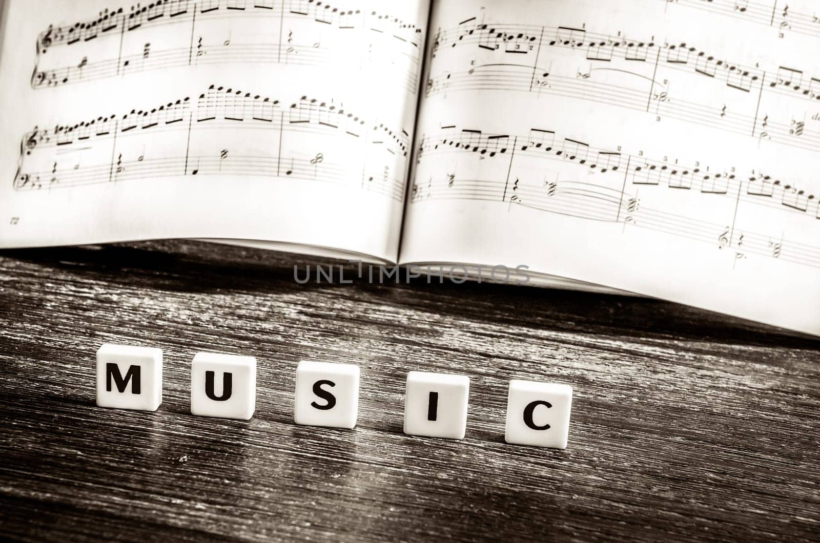 Music notes sheet and letters music in vintage style