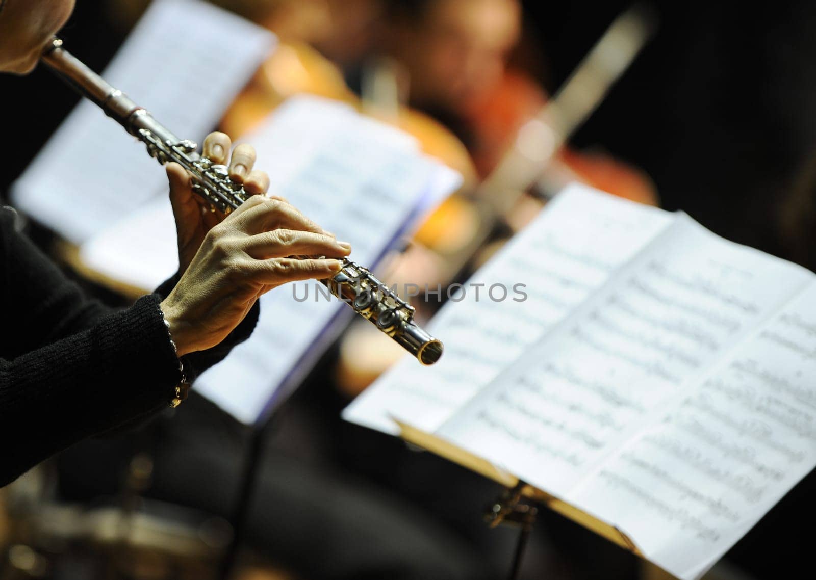 Woman playing flute during a classical concert music
