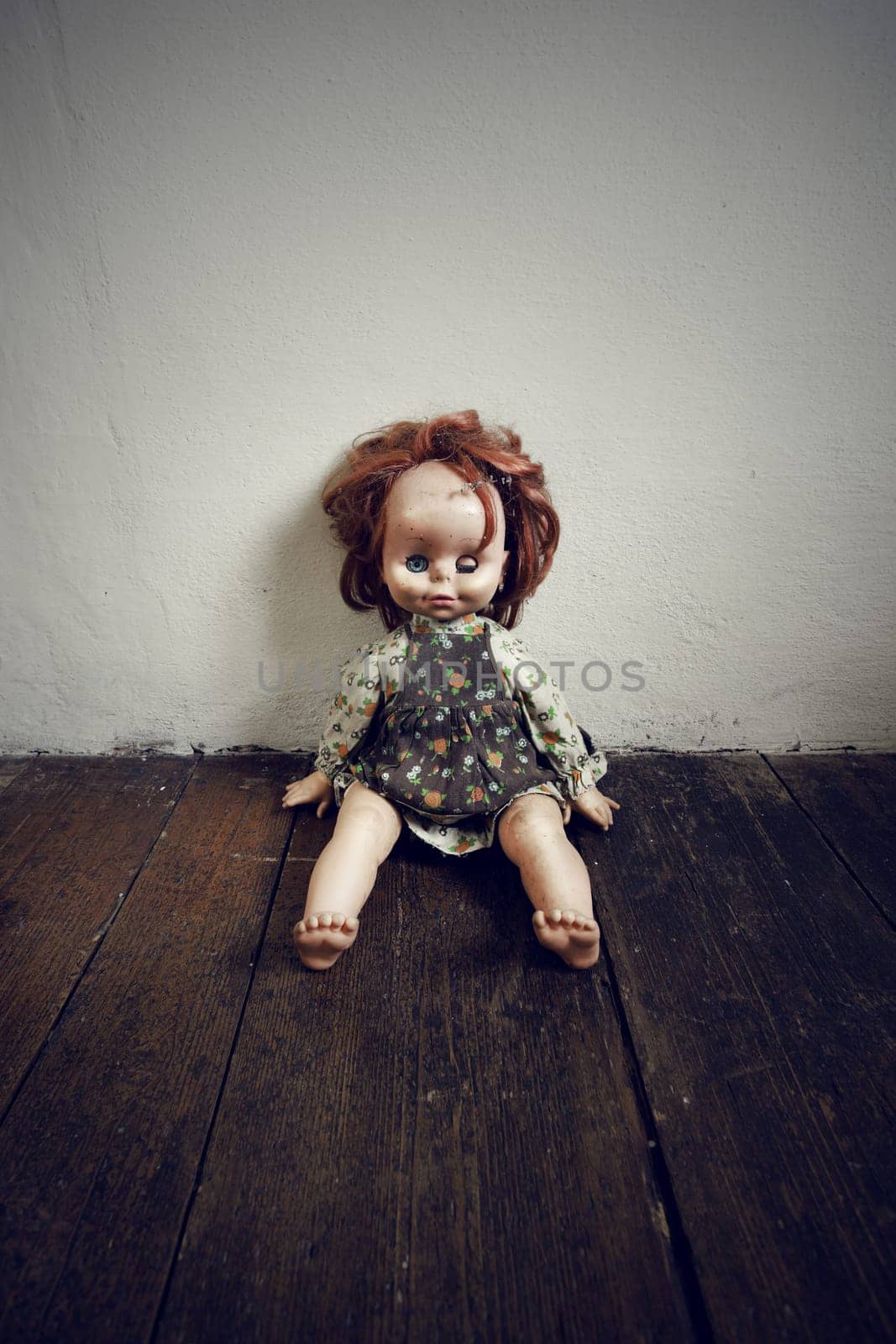 Creepy Vintage Doll on wooden floor
