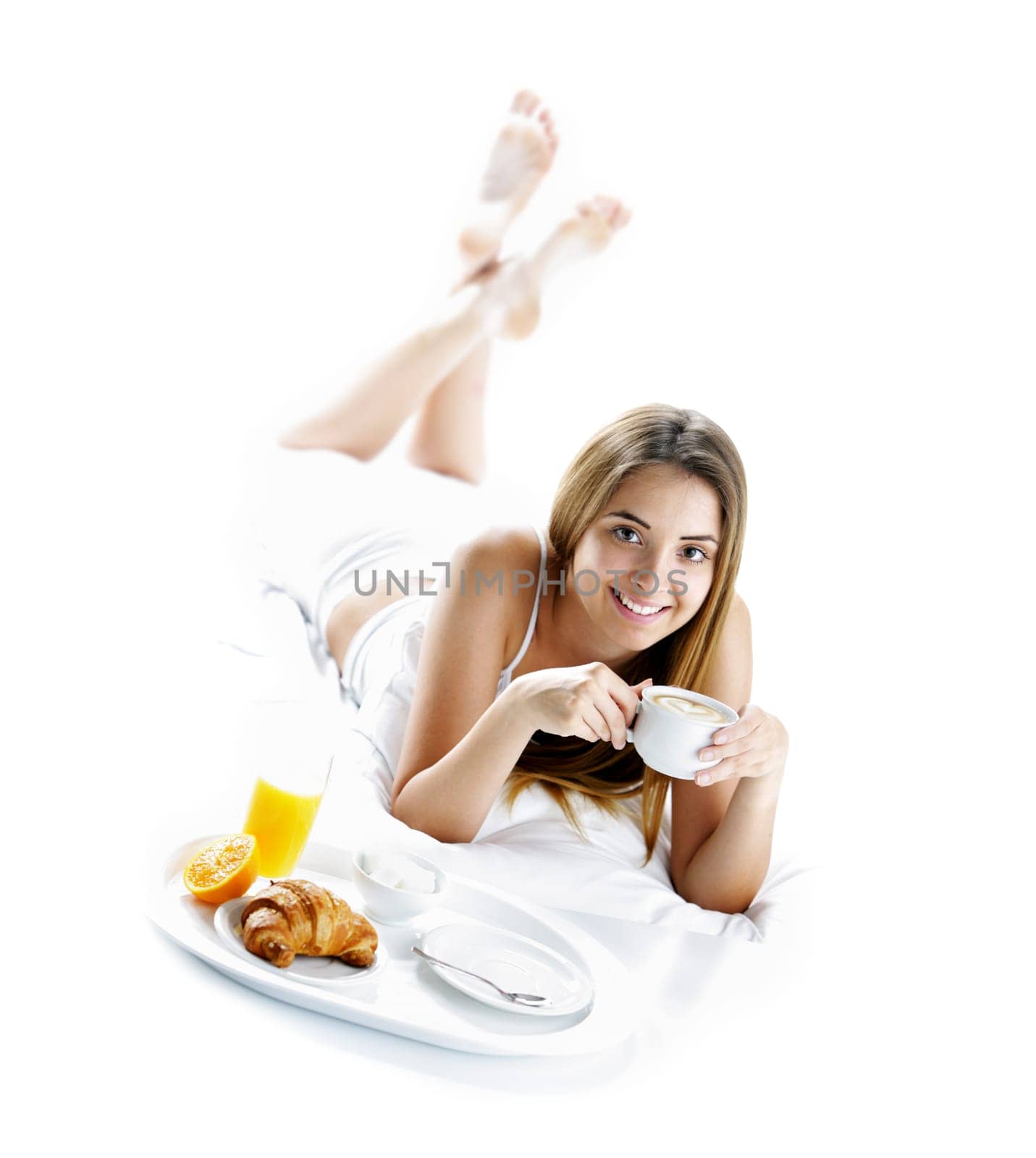 Young beautiful woman having breakfast in bed.
