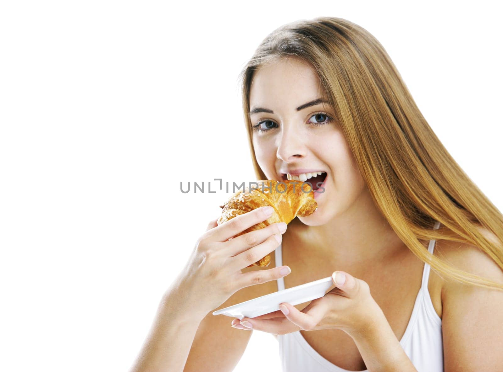 Young beautiful woman having breakfast. Isolated on white background