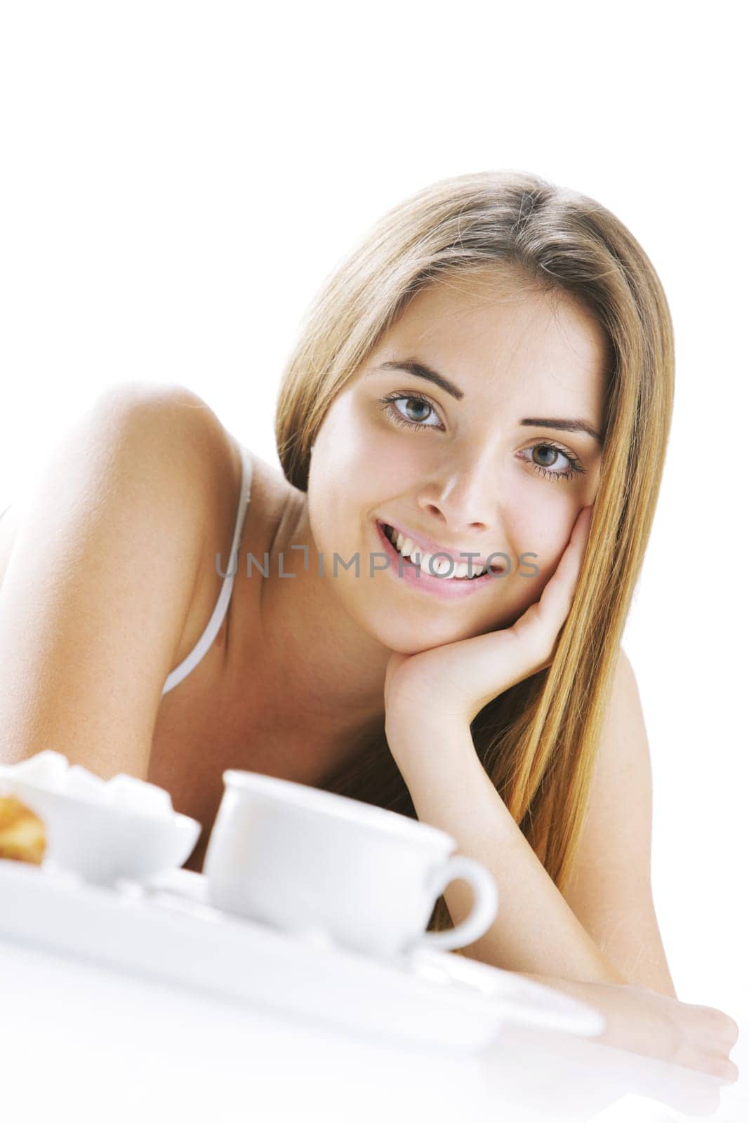 Young beautiful woman having breakfast in bed.