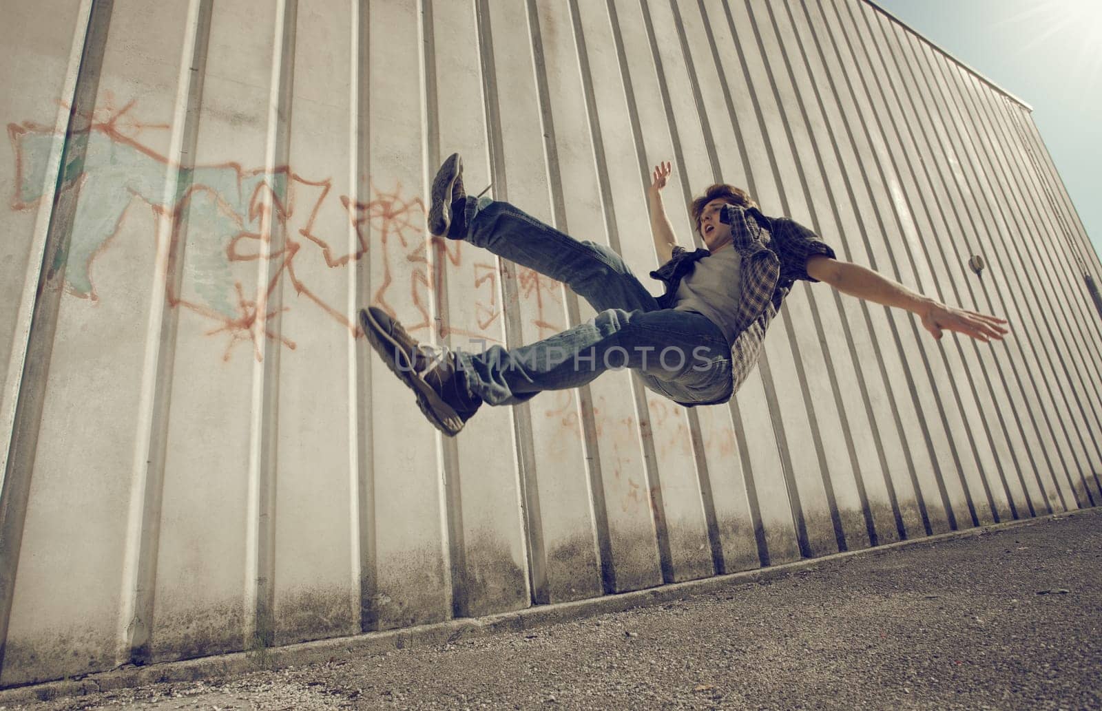 Young man falling from a building