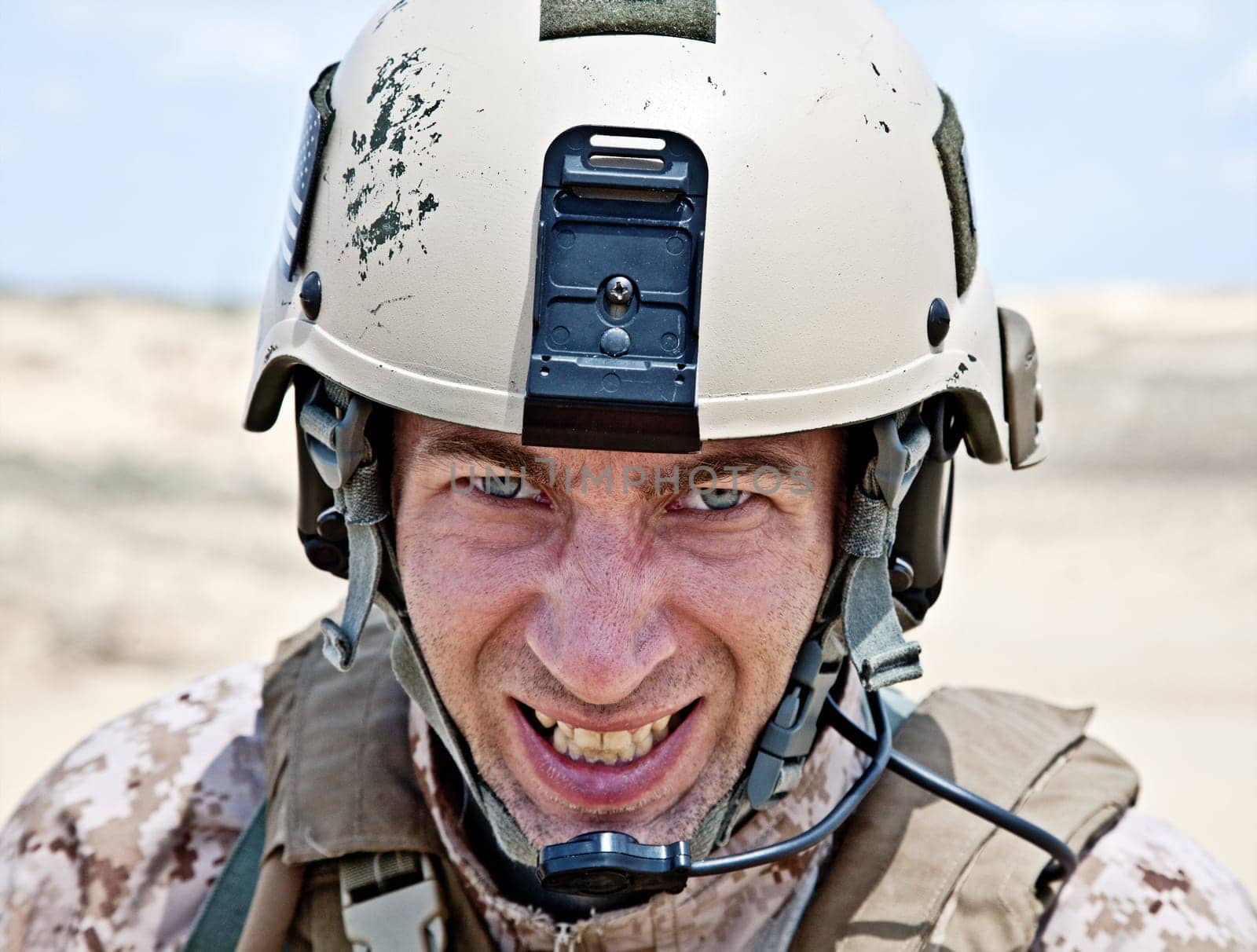 Scary face of US marine in the MARPAT uniform showing teeth