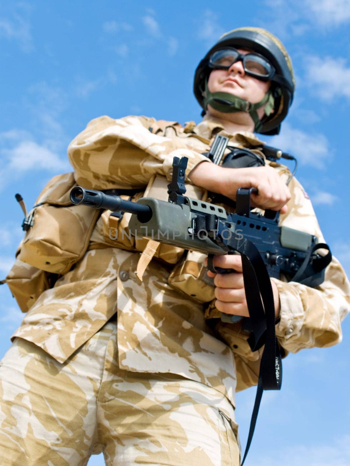 British Royal Commando in desert uniform holding his rifle