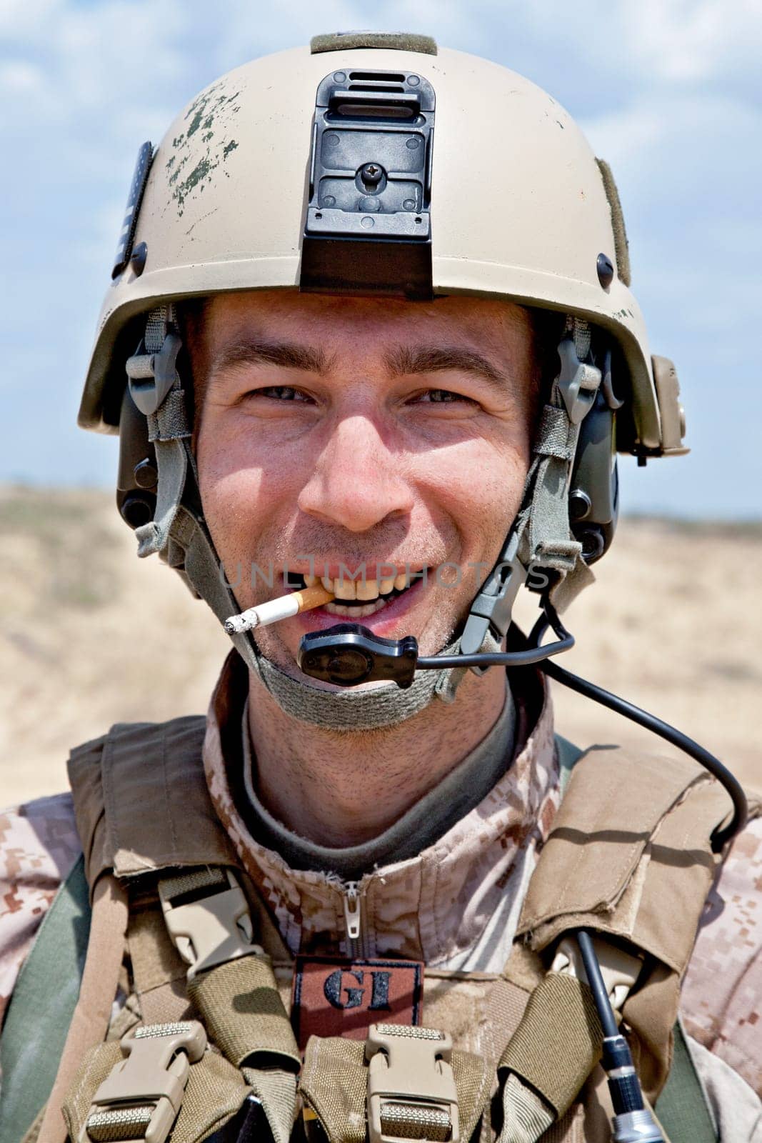 smiling US soldier smoking a cigarette