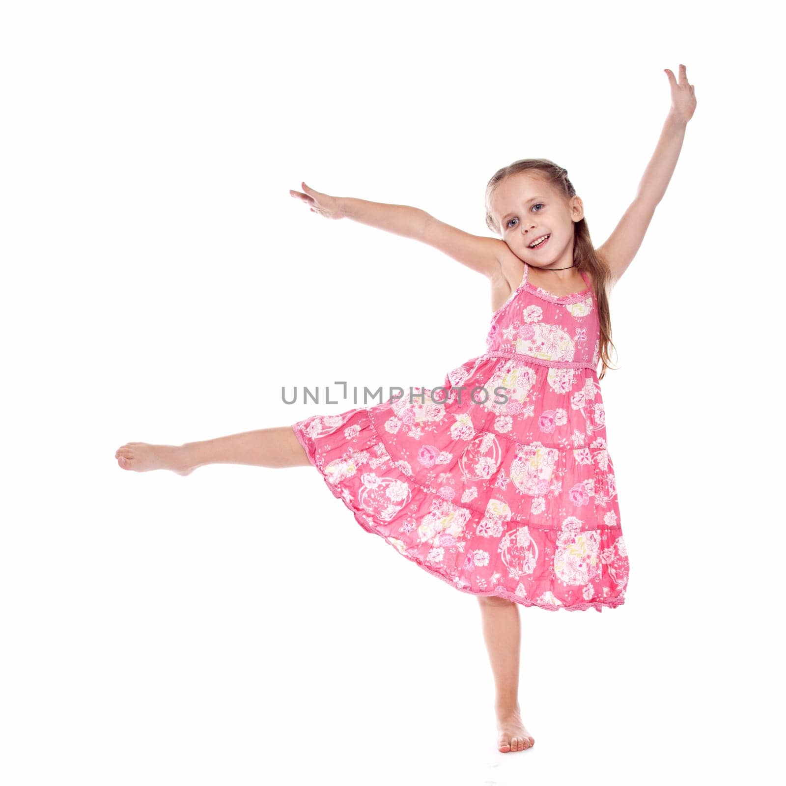 pretty little girl dancing on the white background