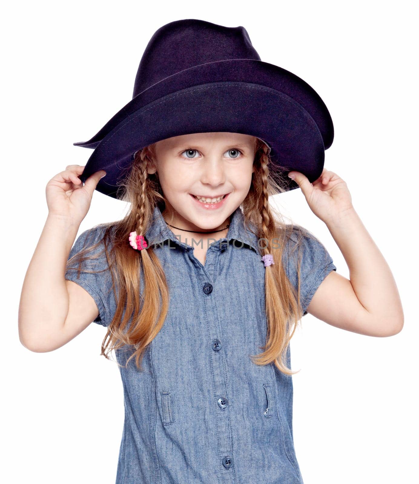 little girl in blue dress wearing the big black hat
