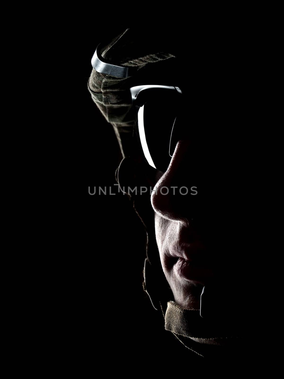 US soldier in the helmet on the black background