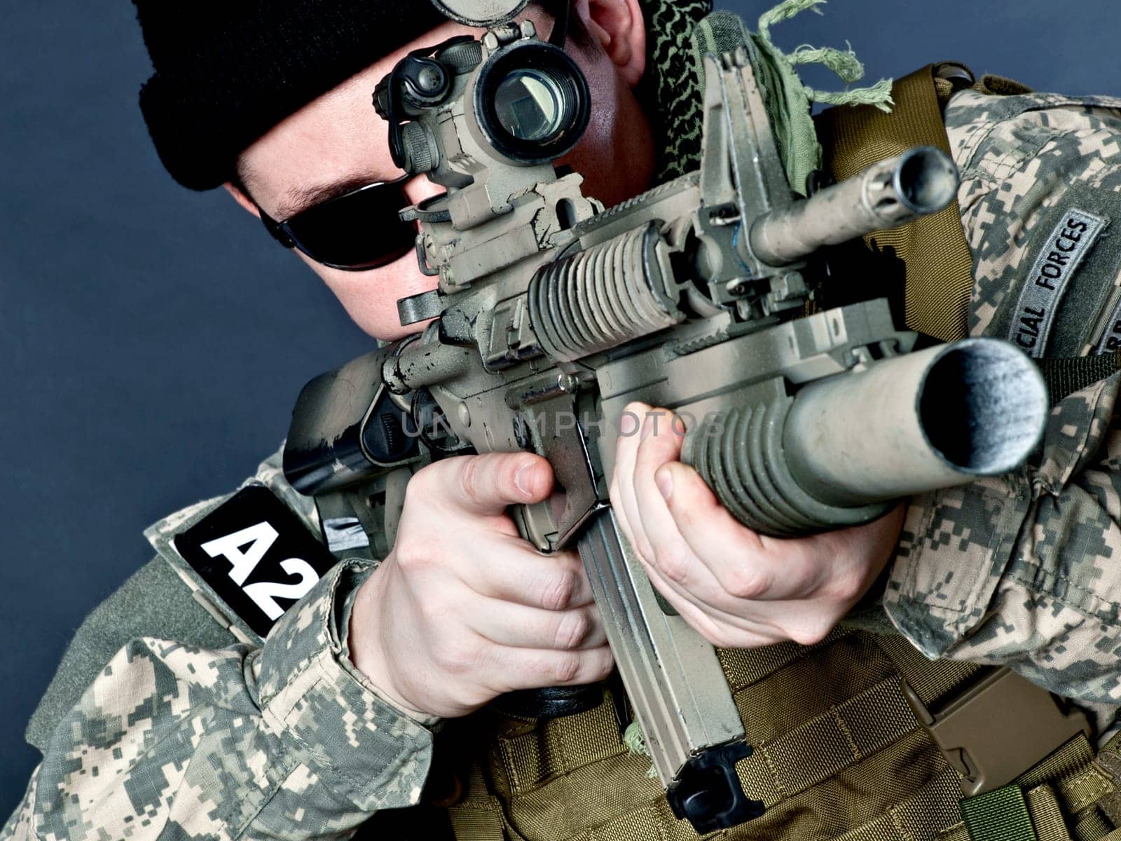 US soldier aiming with his assault rifle