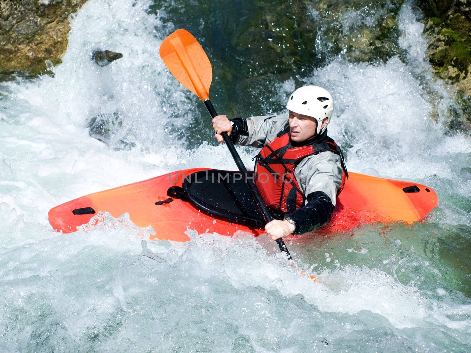 an active kayaker on the rough water