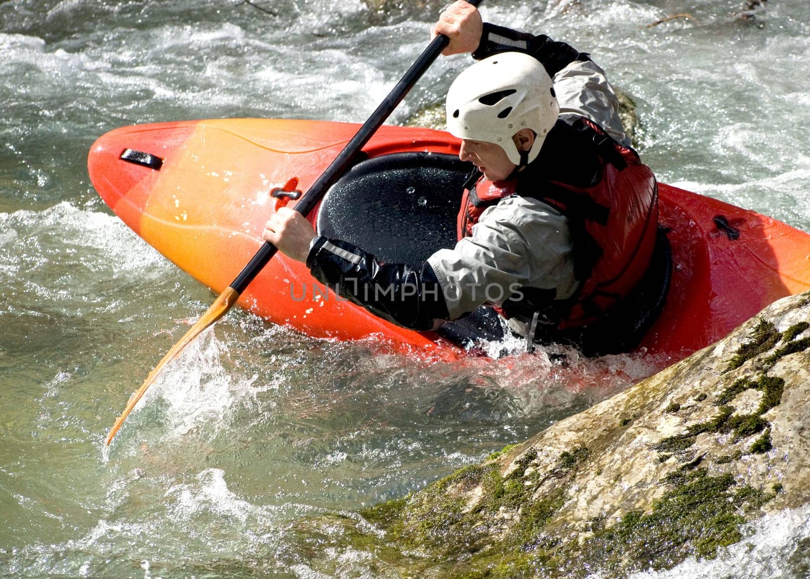 an active kayaker on the rough water