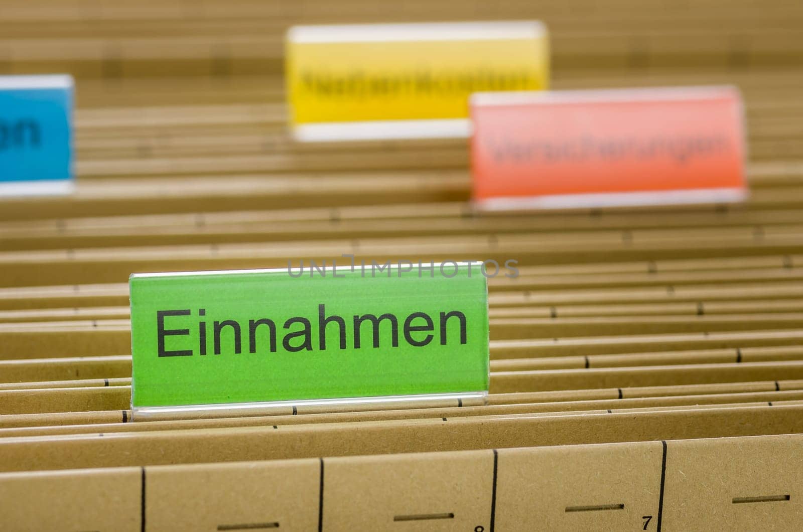 Hanging folders with the inscription Revenue