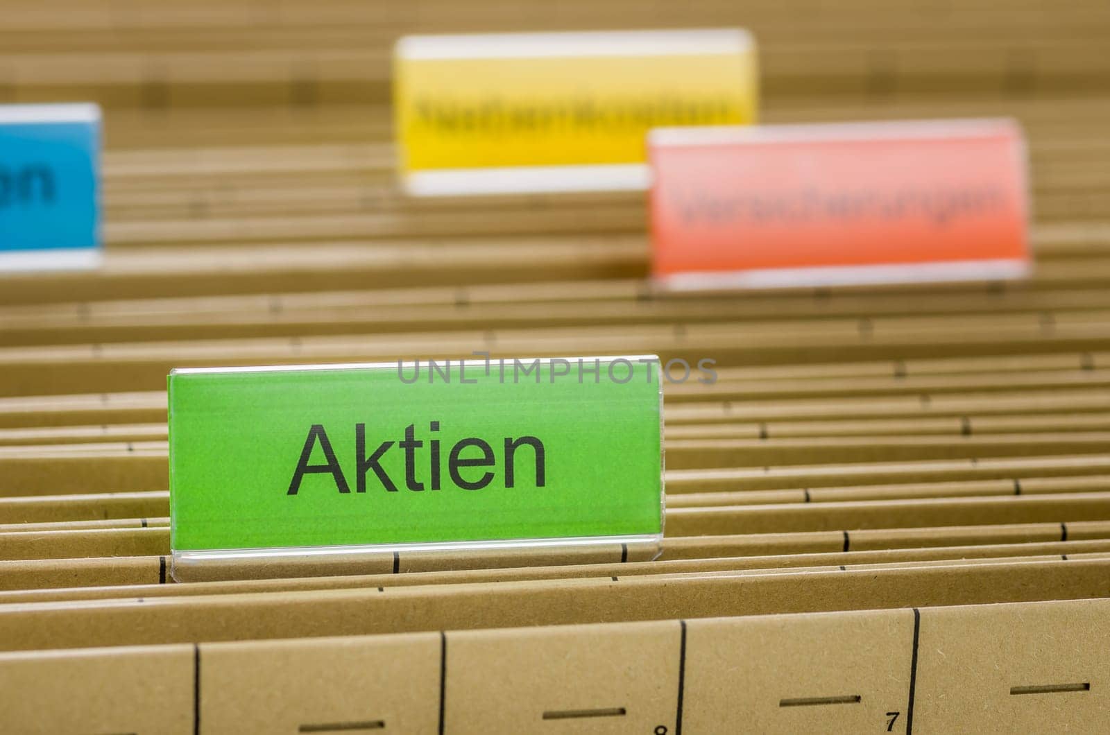 Hanging folders with the inscription Shares