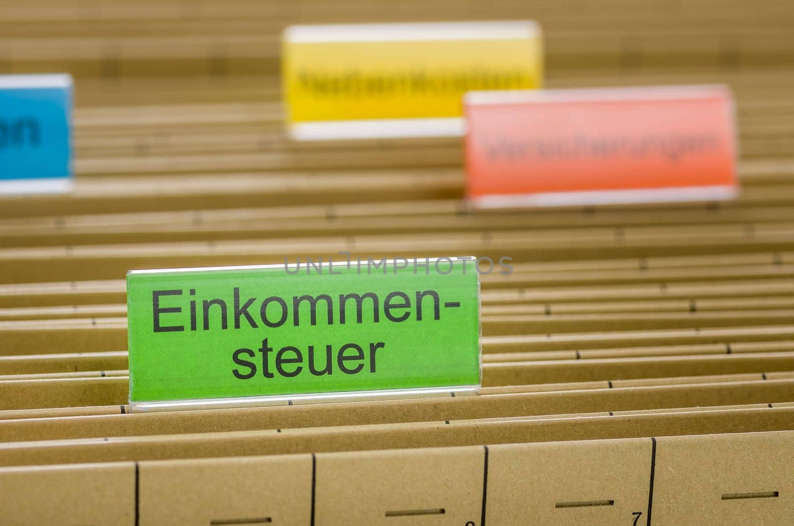 Hanging folders with the inscription Income Tax