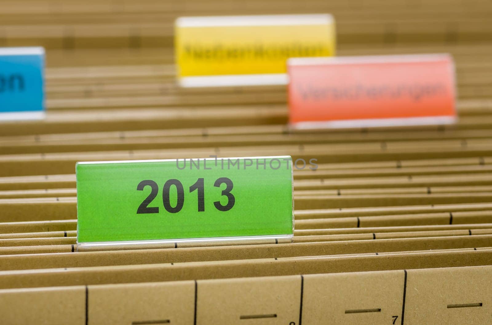 Hanging folders with the inscription 2013