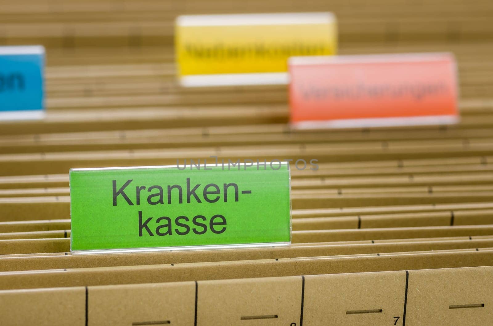 Hanging folders with the label Health Insurance