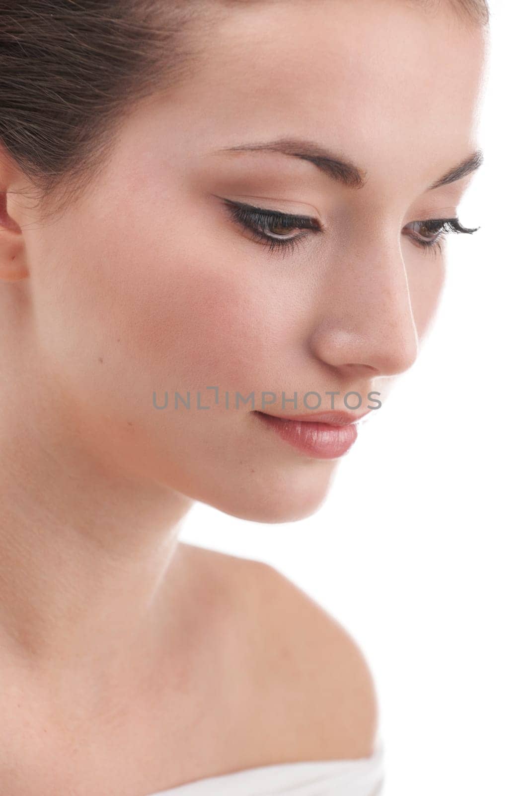 Young womans face with subtle make up and eye lash extensions