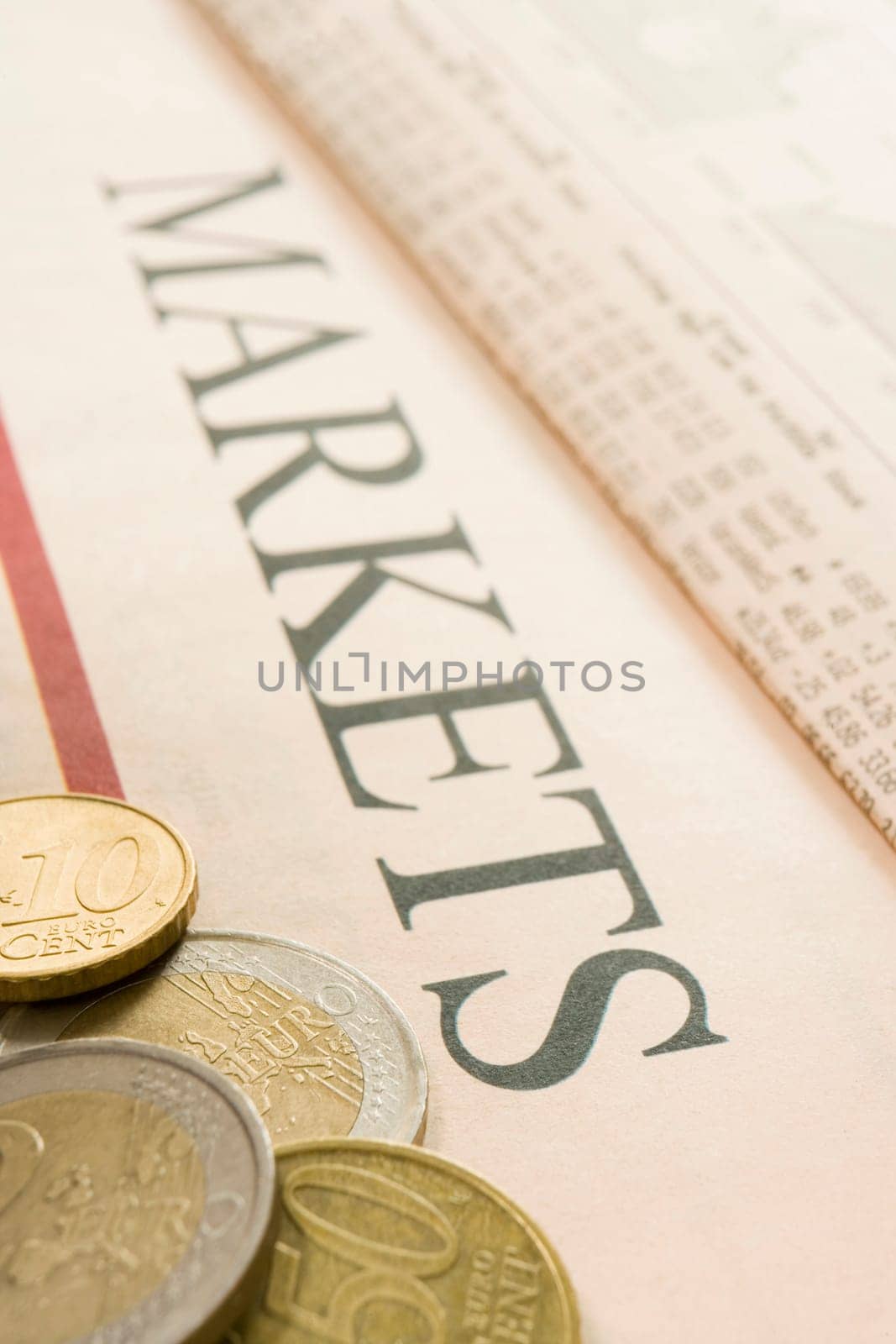selection of euro coins on paper marked Markets