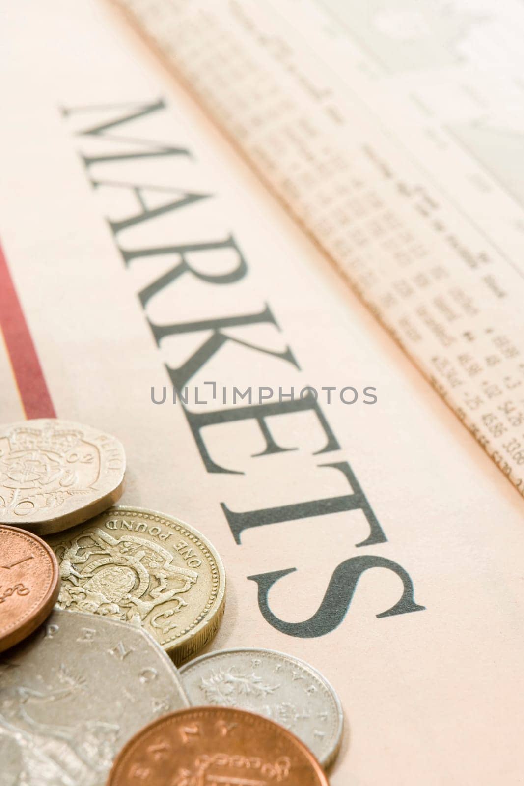 selection of british coins on paper marked Markets