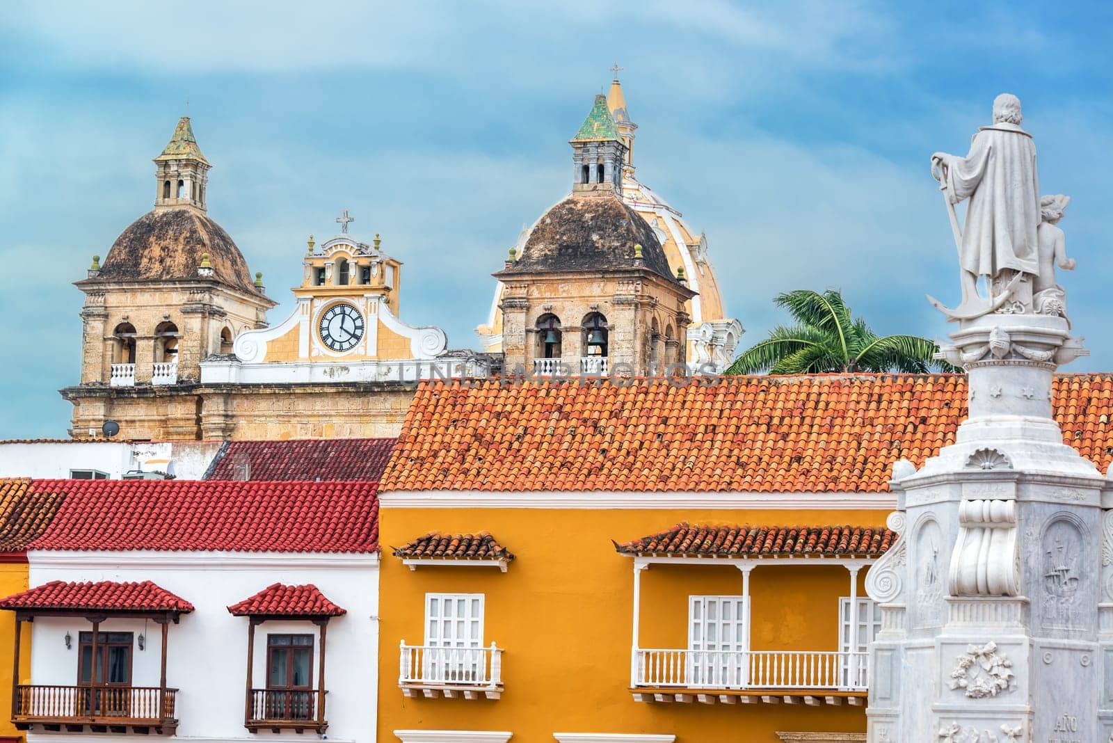 Colorful colonial buildings with the church of San Pedro Claver in the background in the historic center of Cartagena, Colombia