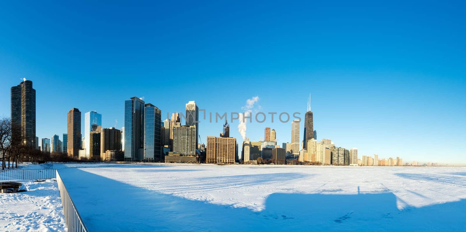 Panoramic view of downtown Chicago with frozen Lake Michigan in the foreground