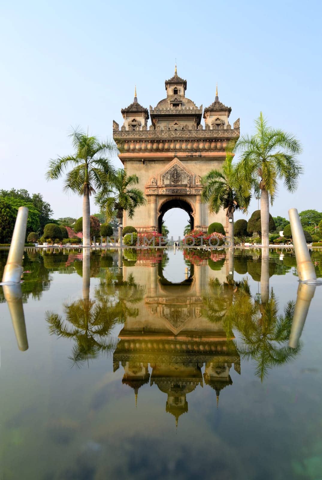 Patuxai arch monument reflecting, Laotian arc de triomphe Vientiane, the Capital of Laos.