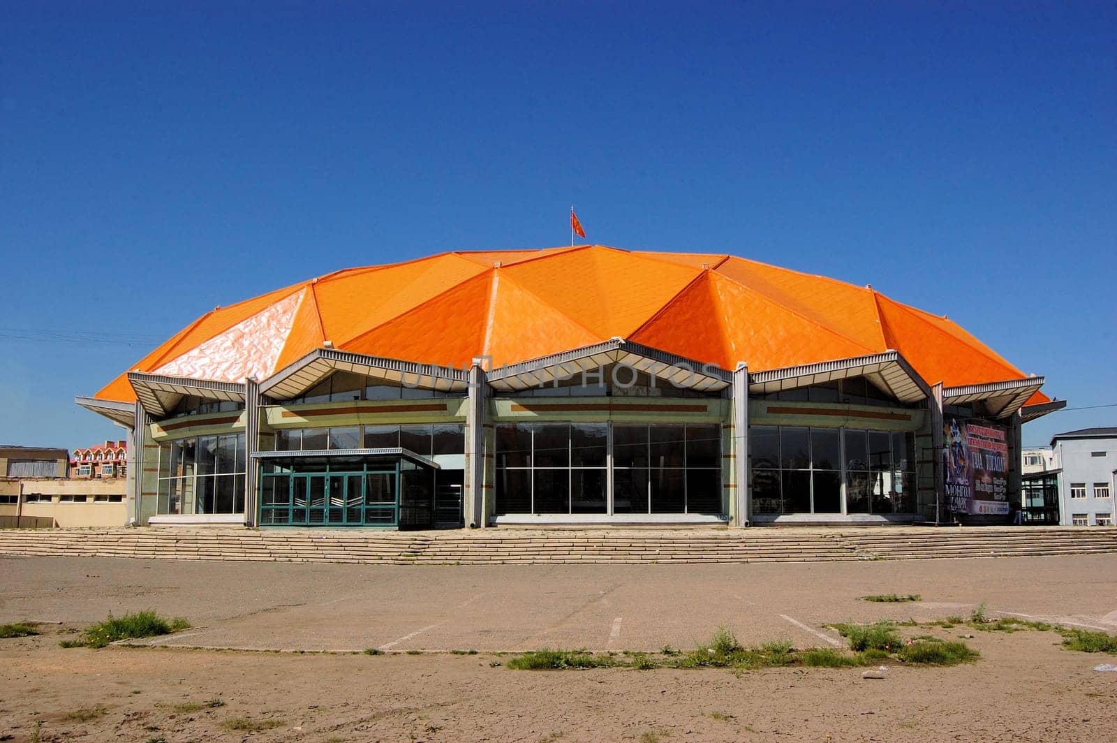 A building with an orange geodesic dome in Ulan Bator, Mongolia