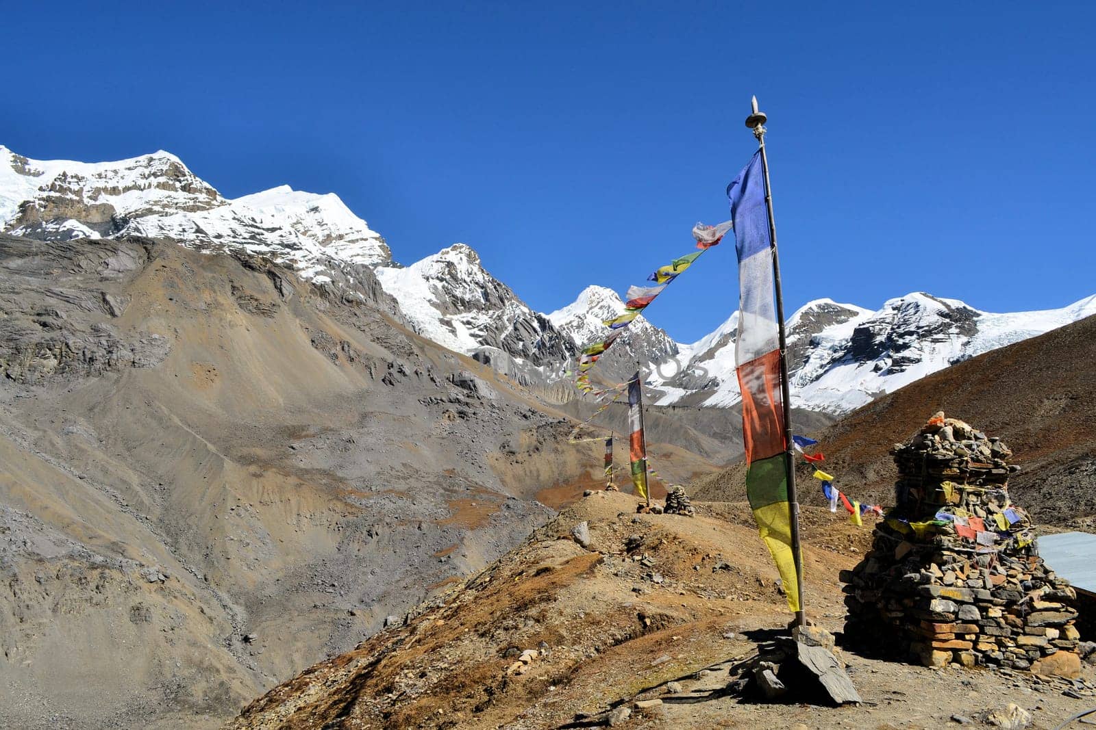 Buddhist prayer flags flowing in the wind in the himalaya mountains, Nepal