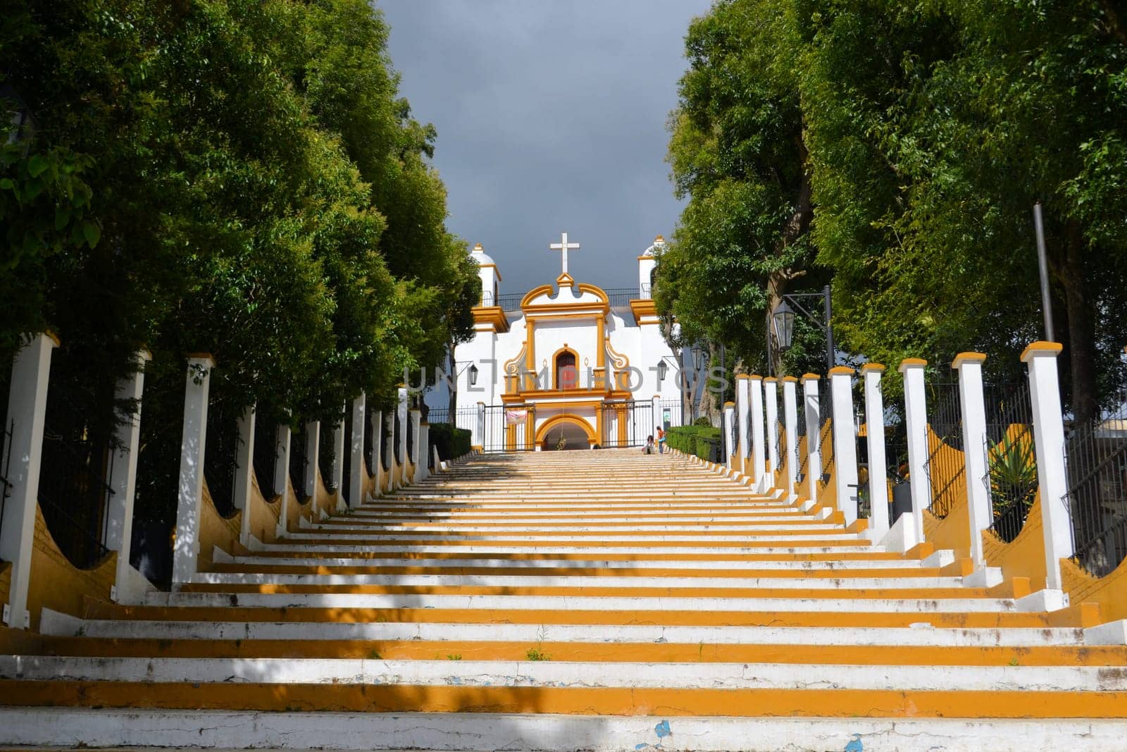 A Christian Catholic chapel on a hill with colorful steps in San Cristobal de las Casas, Chiapas, Mexico