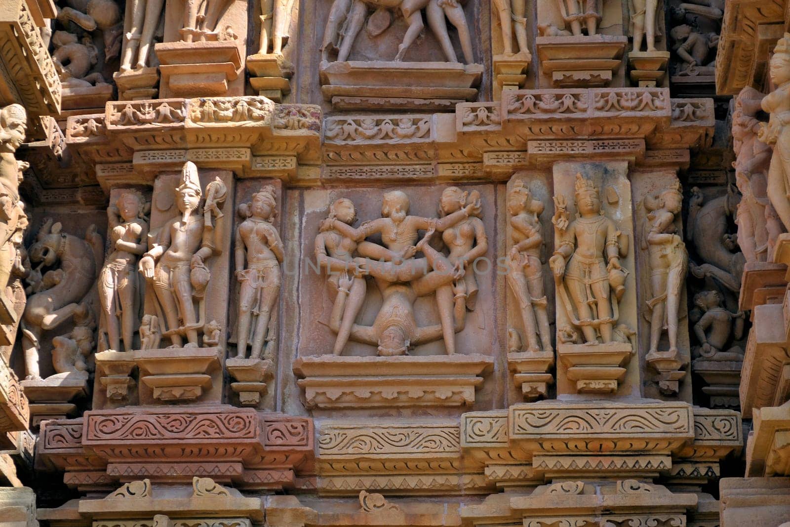 Erotic depiction of a sexual act on a temple wall in Khajuraho, India