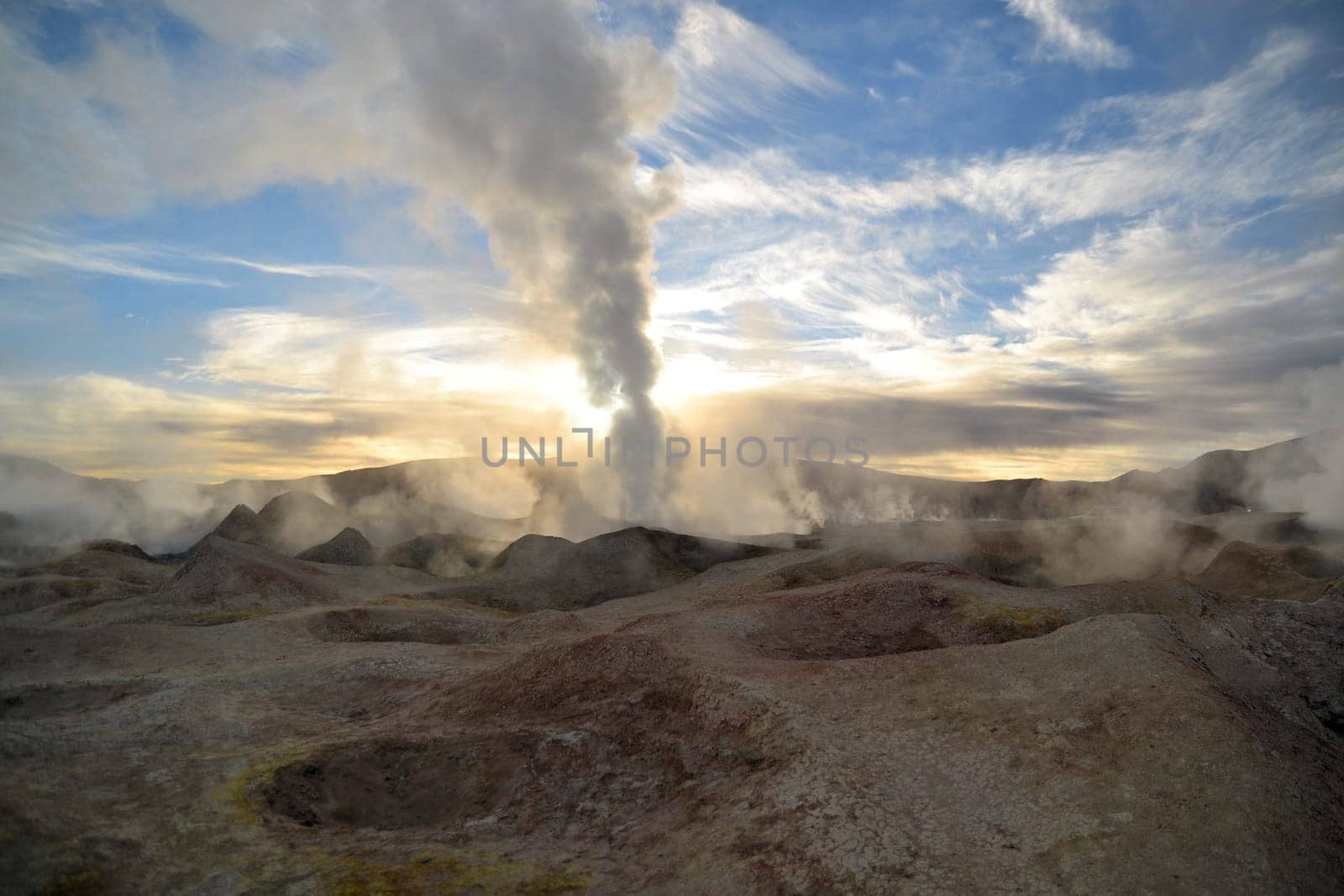 erupting geyser of steam with sulfur deposits, Bolivia