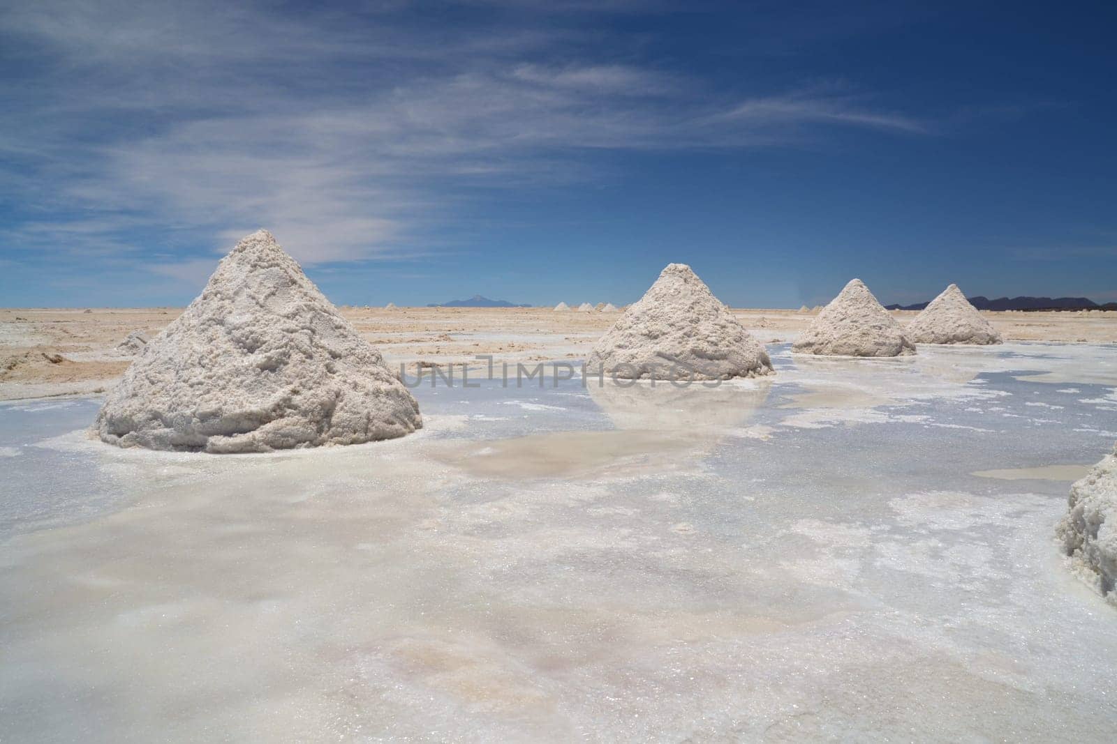Heap of sea salt in a Bolivian salt flat prepared for harvest