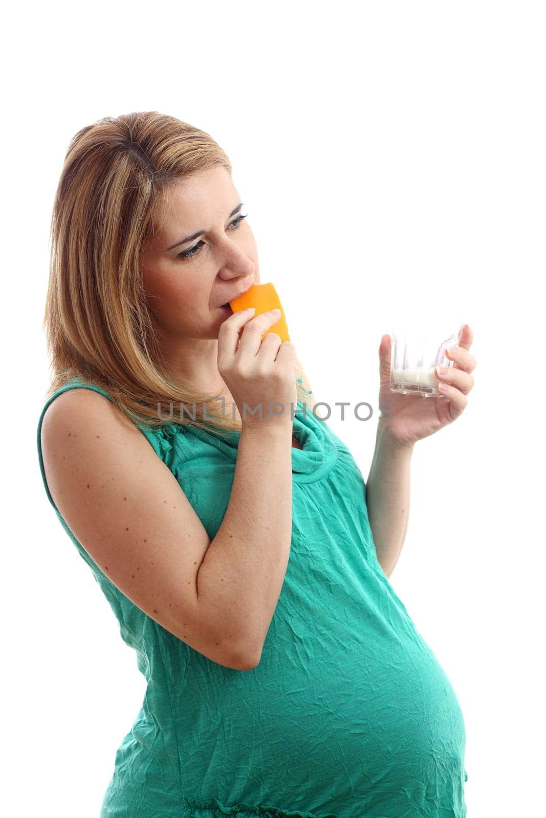Details of a pregnant woman with a glass of milk and cheese isolated on white background.