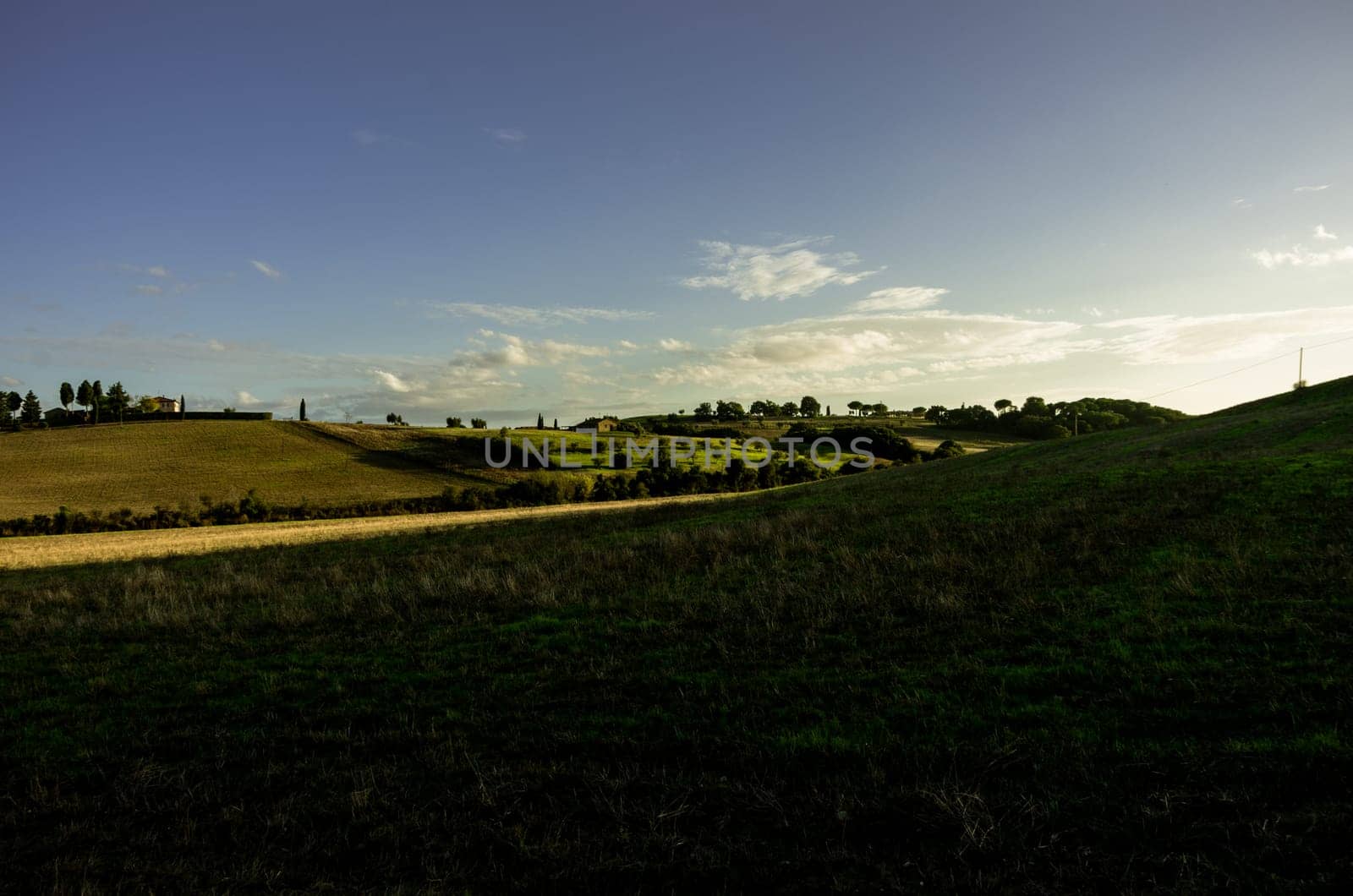 Fields lightened by te sunset in tuscany countryside