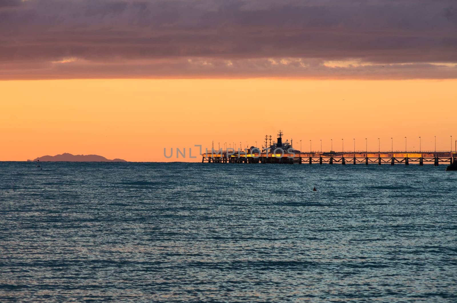 Sunset over a commercial dock mostly used to stock ethylene