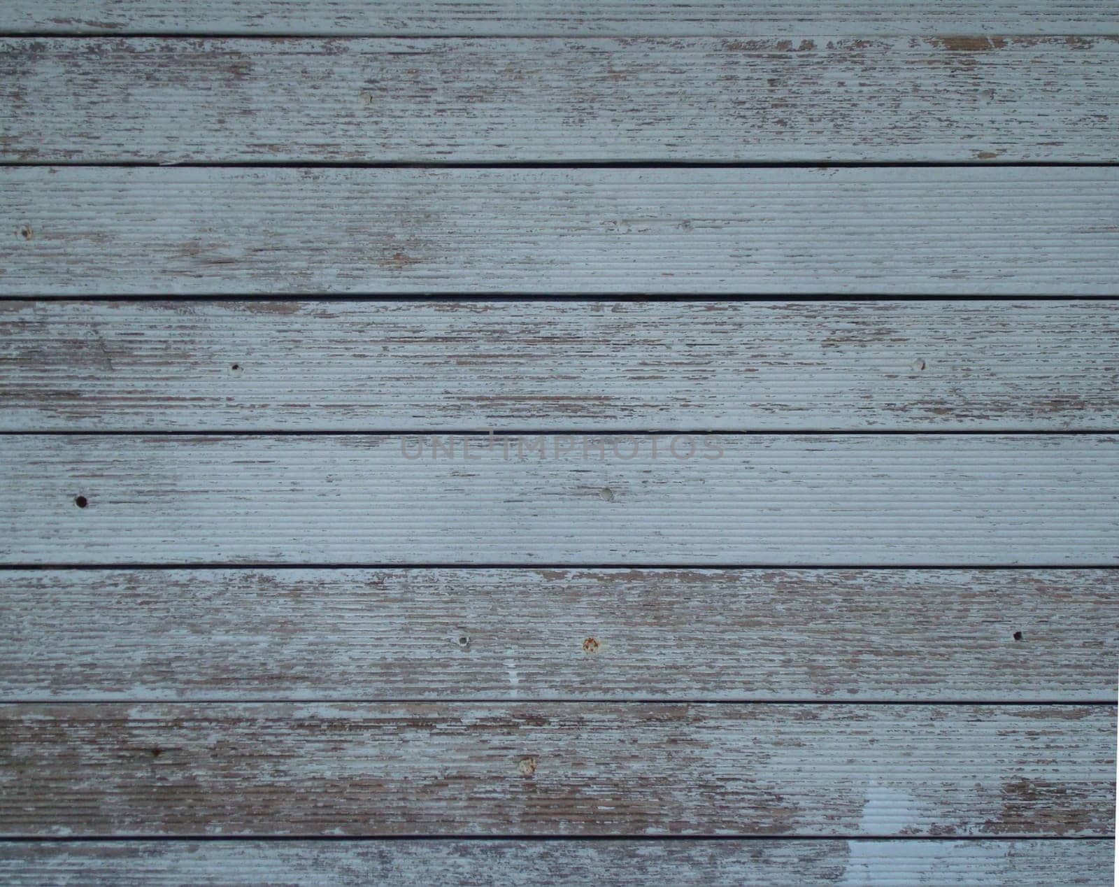 Background: Faded light wooden boards