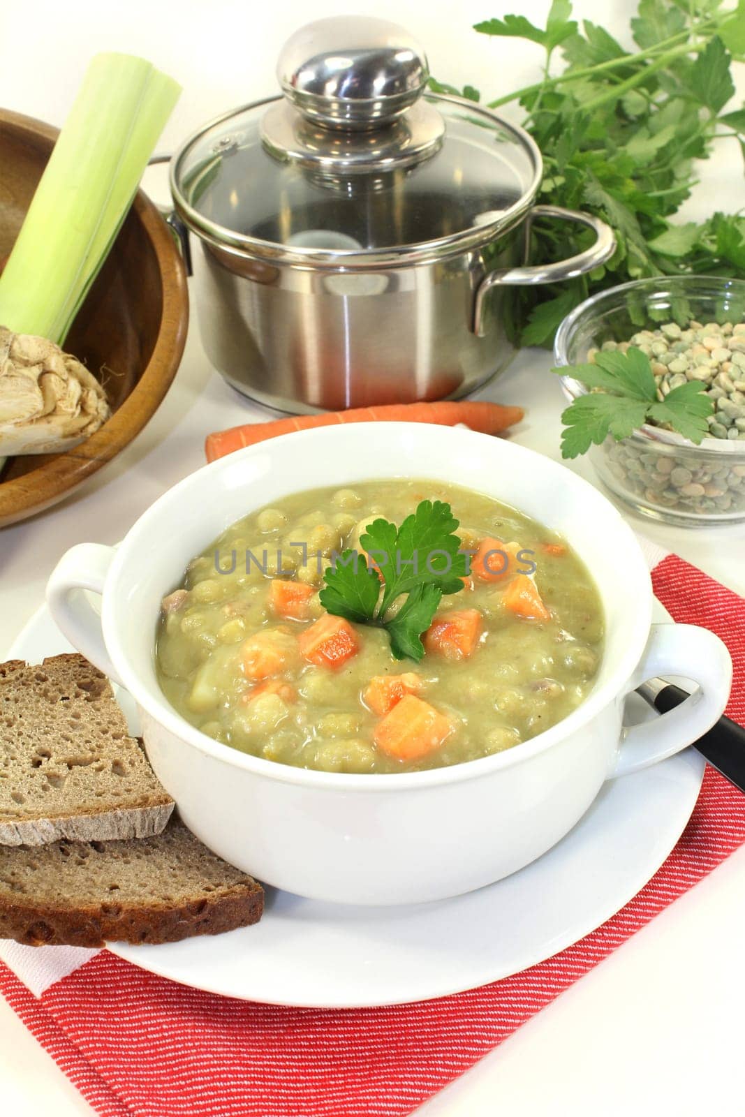 a white cup of pea stew and parsley
